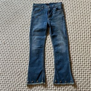 JEANS WITH FRAYED FLARE BOTTOMS